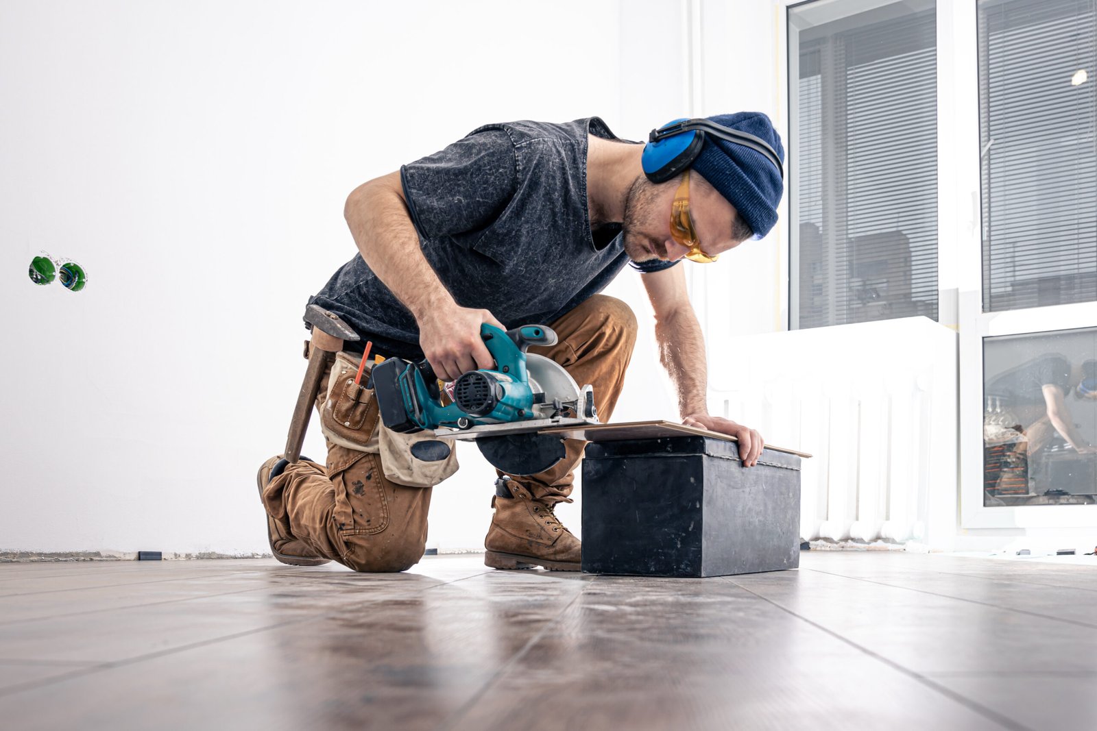 circular saw, carpenter using a circular saw for wood.